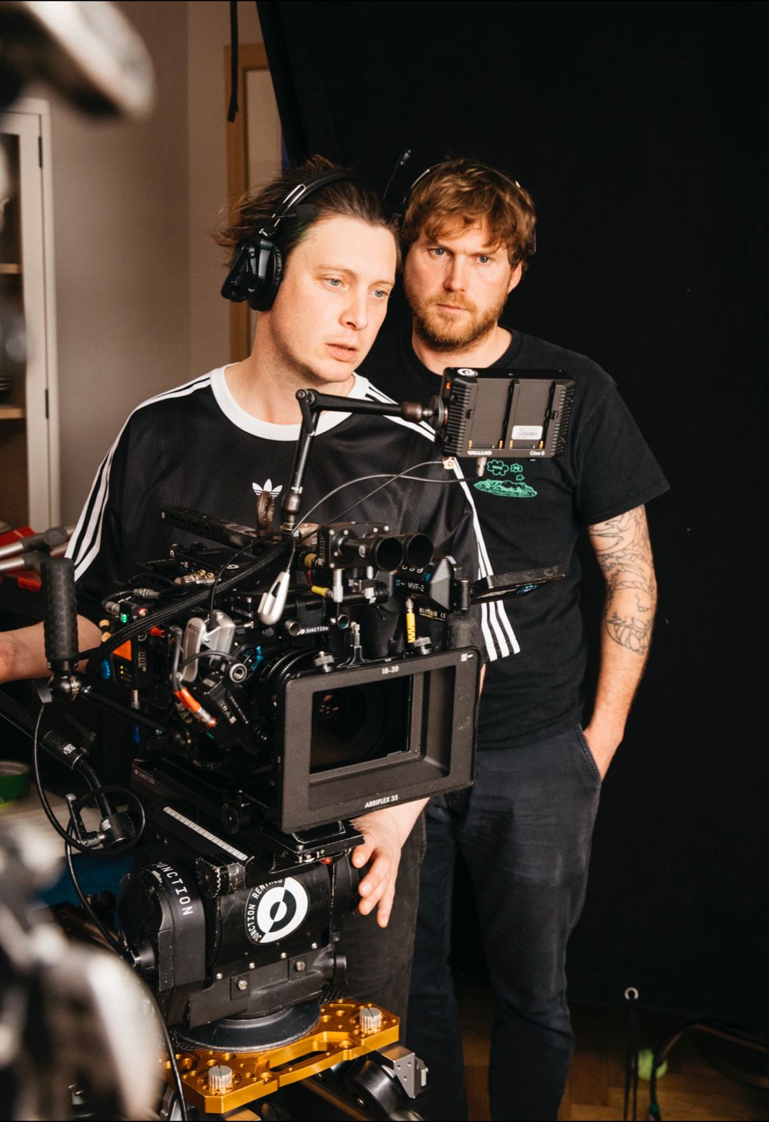 Joe Hofmann and Josh Bamford on set behind a camera